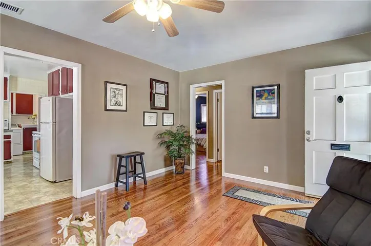 Quick hit #1 of 5: Free flowing open floor-plan helps the home live large. The crisp trim paint really pops against the warm wood hues in the floors of the living room.