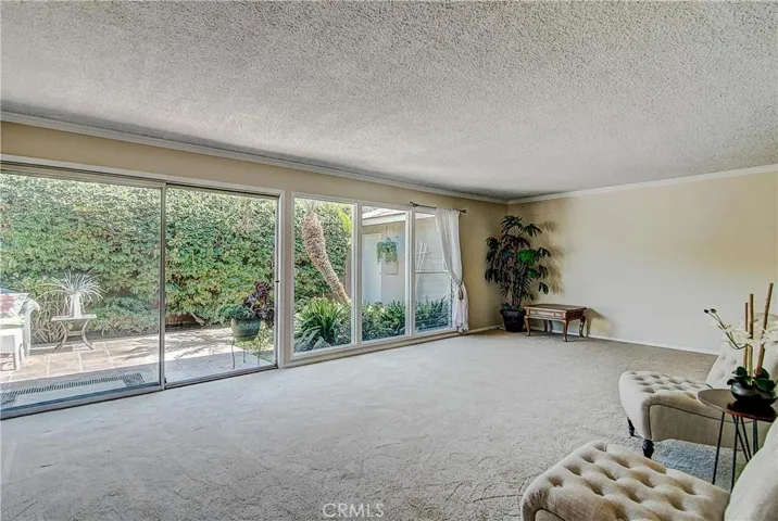 This could be a New York Penthouse, look at that terrace from the huge living room! Yes, that's crown molding, that surrounds most rooms!