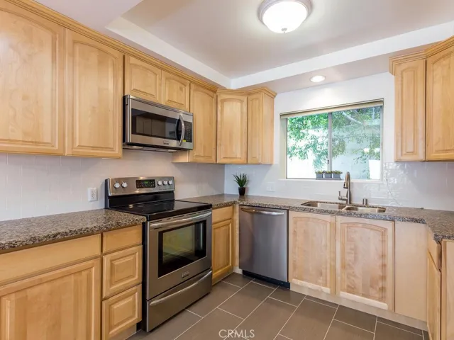 Remodeled kitchen, slate flooring, granite counters, stainless steel appliances, maple cabinets