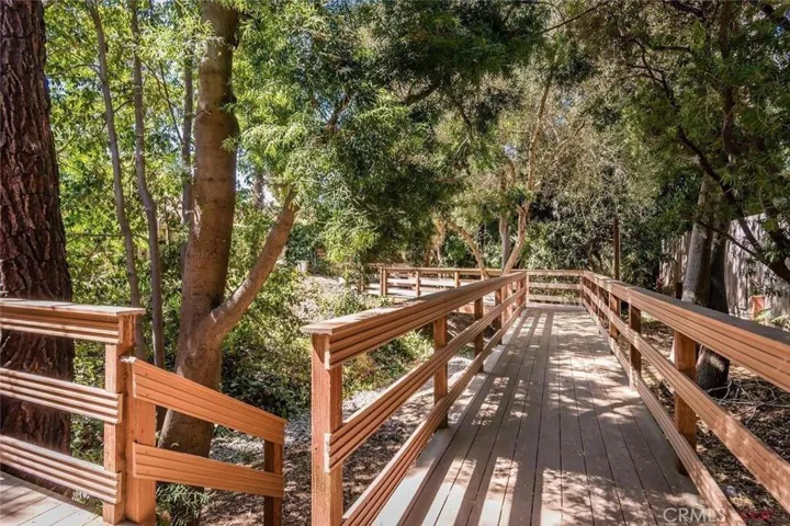 Front entry of home looking toward street.  Composite bridge and decking built in 2010