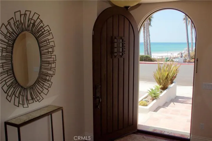 Welcoming entry with an arched doorway.