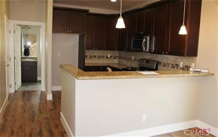 Beyond the kitchen is 1/2 bath with laundry room located behind bath.