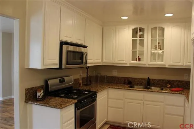 Kitchen with new stove & micro-hood; granite countertos