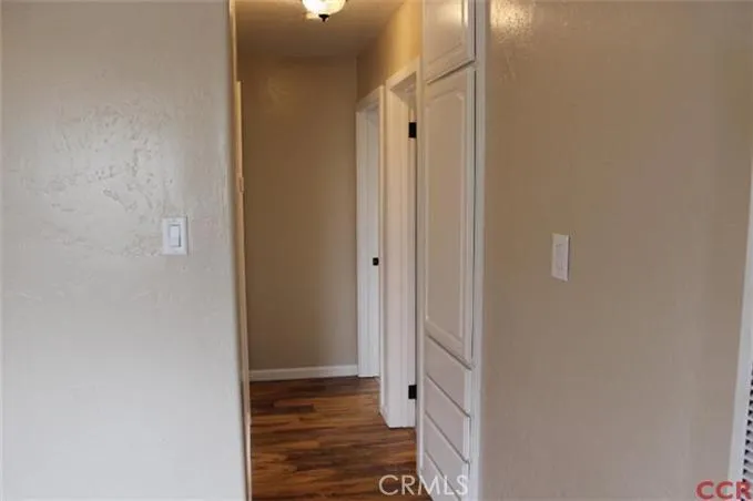 Hallway to bedrooms with built ins