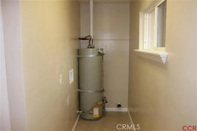 Laundry area located behind kitchen