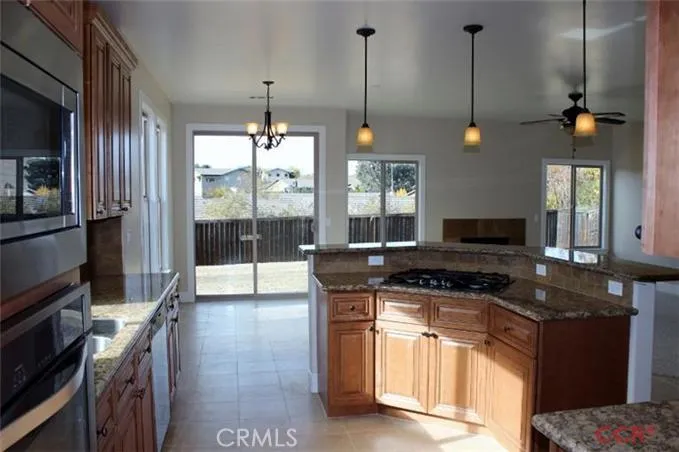 View of kitchen facing out to dining nook and Great Room