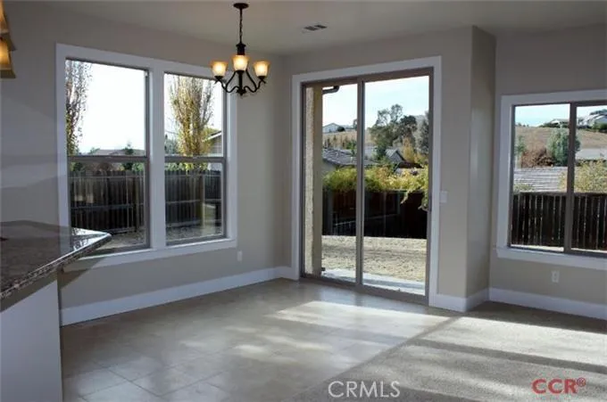 Dining nook with slider to back yard - many windows throughout first floor.