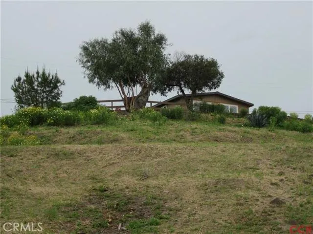 From bottom of lot looking up to home! Country living just minutes to town!