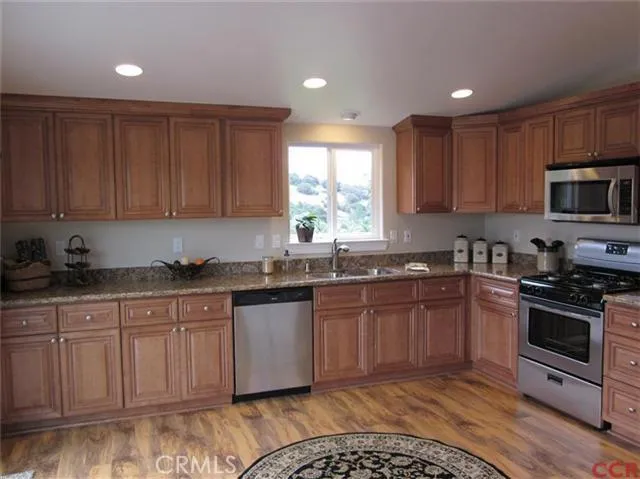 Generous counter space runs length of kitchen!