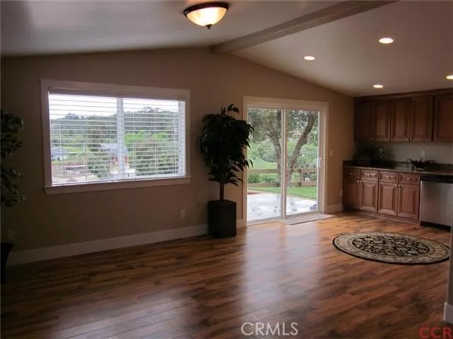 View from living room to dining area with slider to patio.