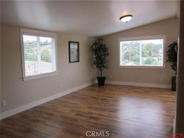 Laminate wood floors, baseboards, new windows and blinds!
