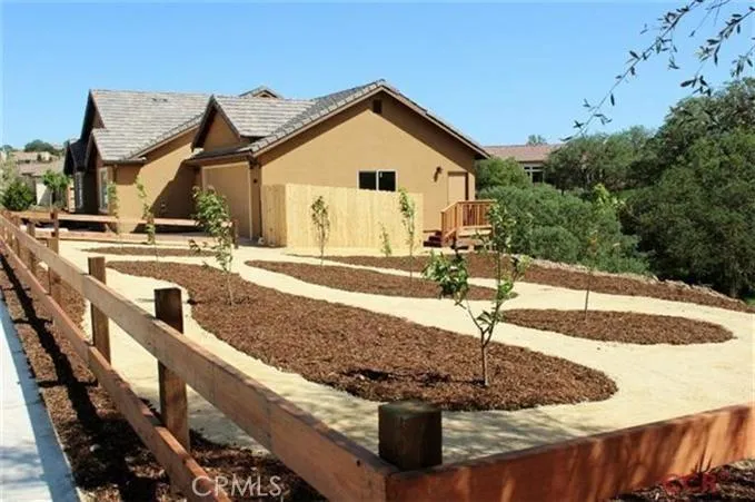 The large side yard allowed for a special creative touch - a variety of fruit trees along with a decomposed granite pathway have been added!