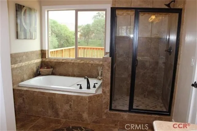 Master bath with separate shower and bath tub.
