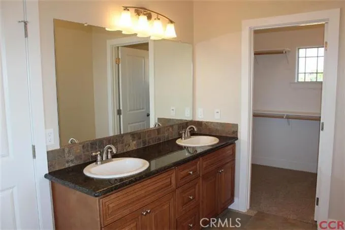 Master bath vanity area with dual sinks
