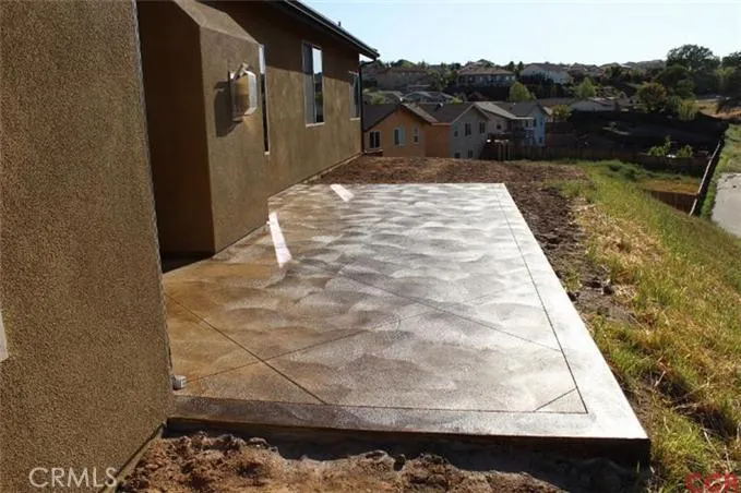 Stamped, stained concrete patio off of living room slider