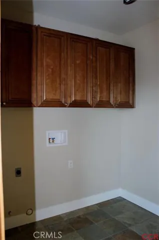 Laundry area is located off of kitchen