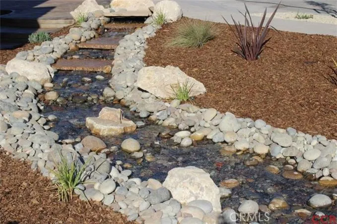 A refreshing, peaceful, recirculating water feature welcomes you home.