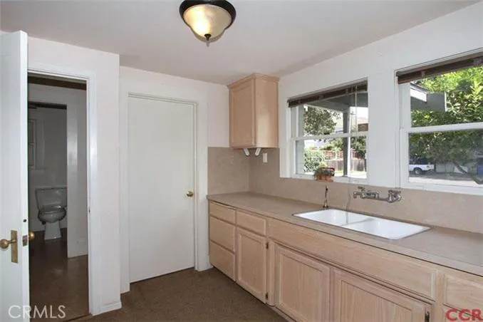 Downstairs Kitchen area facing rear parking.