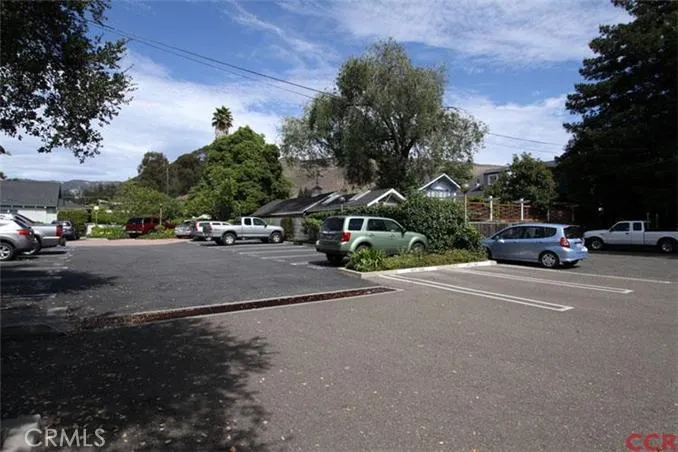 Parking lot with 7 owned spaces.