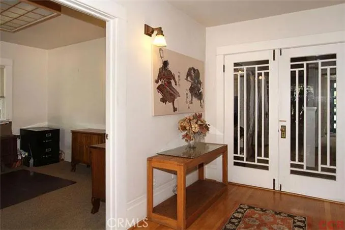 Restored Craftsman doors leading to rear offices.