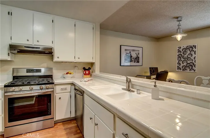 Acres of counter space, and tons of cabinet, help this kitchen live large!