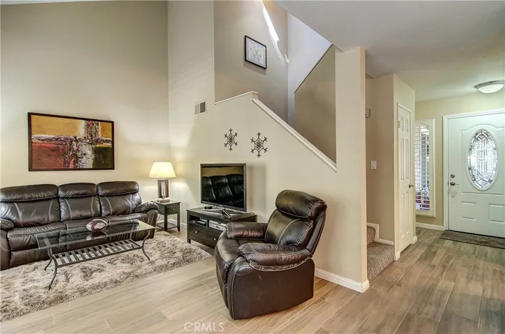 Welcome, let's tour: Formal Entrance with Leaded Glass Front Door, opens to the Expansive Living Room.