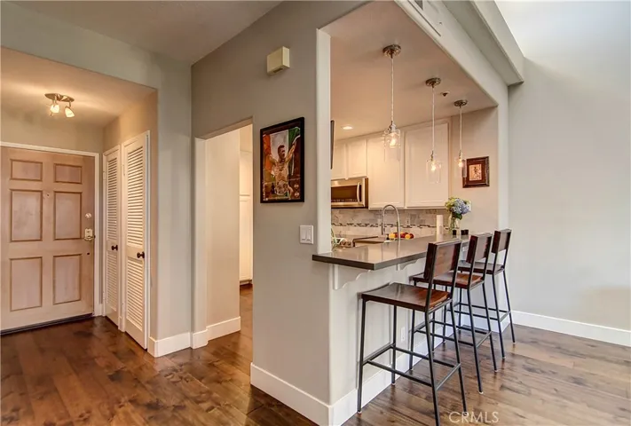 Formal Entry creates a grand introduction. Check out these hardwarood floors & custom baseboards.