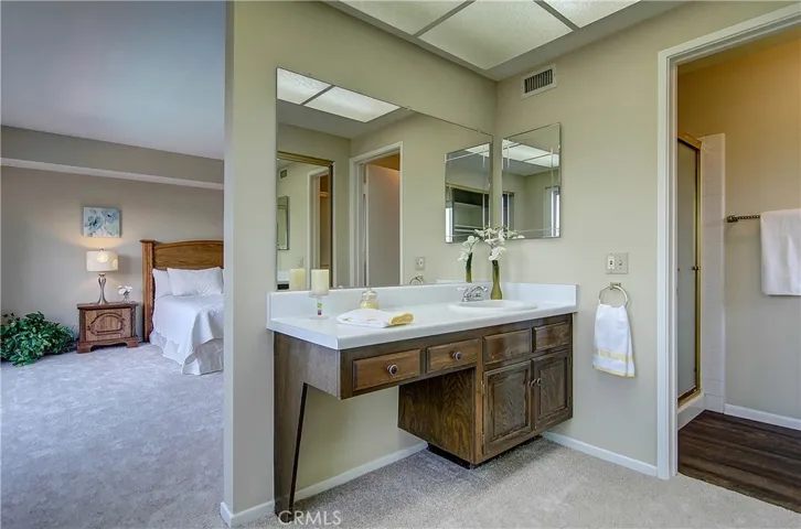 Master suite offers large bedroom, and plenty of dressing space, plus separate shower/commode area.