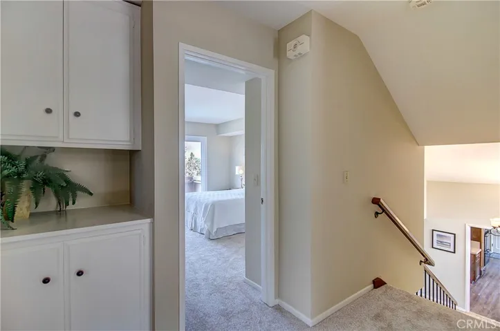 Large, upstairs foyer provides easy transition from room to room and downstairs...plus large linen storage.