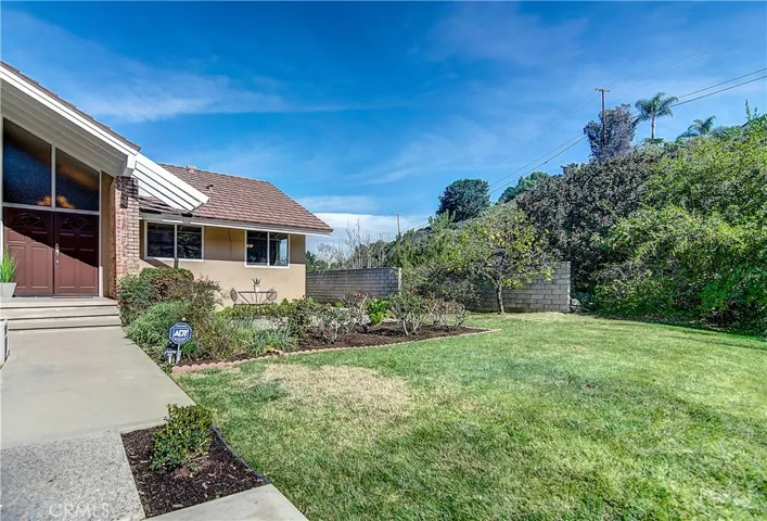 Expansive front yard and setback from the street really give this executive home an estate quality.