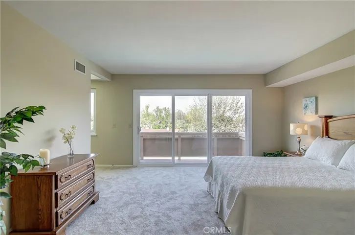 Huge Master suite boasts Triple Slider to view deck