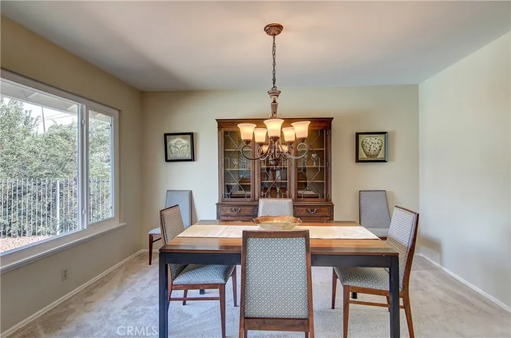 Formal dining area is perfect for cozy dining, or large family gatherings.