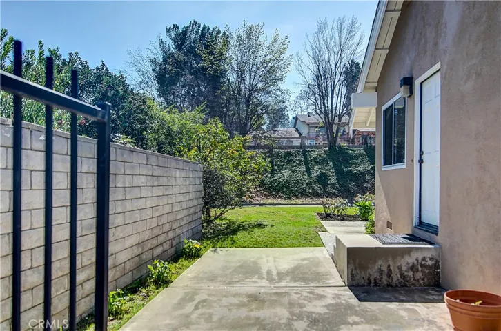 Perfect BBQ area right outside of kitchen, and convenient to rear yard and pool area.
