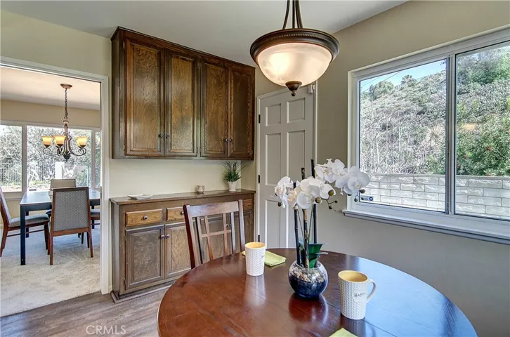 Spacious breakfast knook has useful built-in cabinetry for storage and extra counter space for staging multi-course meals.