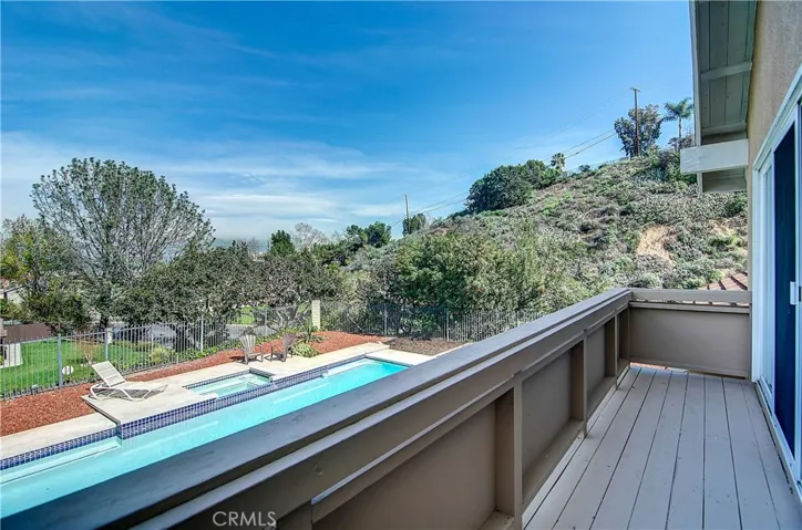 Awesome views of rear yard, pool area, hillsides, valley and snow capped mountains in the distance...all from master bedroom balcony!