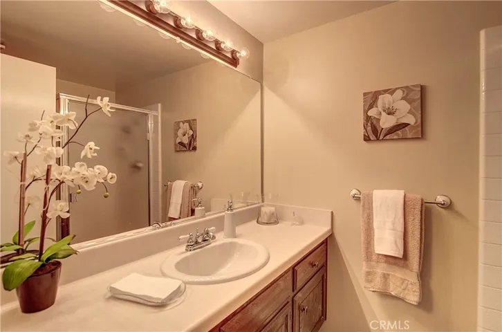 Gleaming main level bath has shower and large vanity area.
