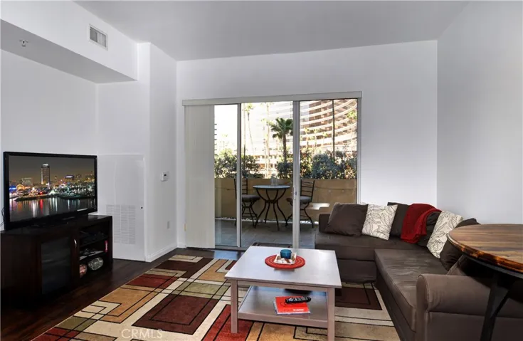 Gorgeous family room, with hardwood floors, new paint, base boards, high ceilings, and plenty of natural light.