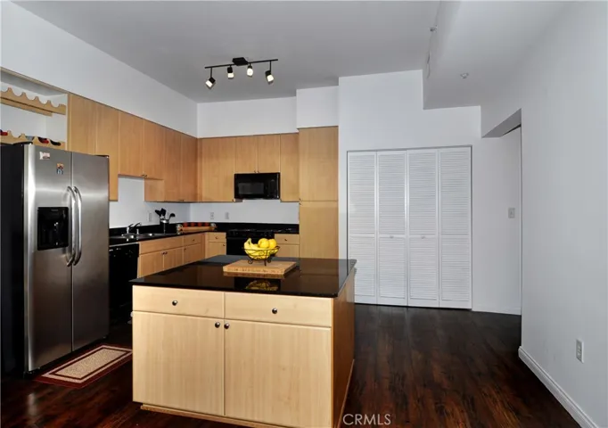 New Stainless Steel refrigerator, granite counter tops, newer appliances, plenty of counter tops, and a huge island makes this kitchen an entertainers dream!