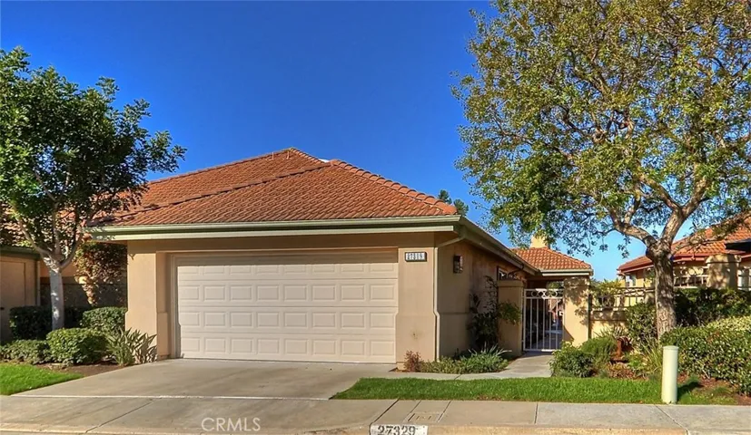Cul-de-sac location is home to this gated courtyard view home.