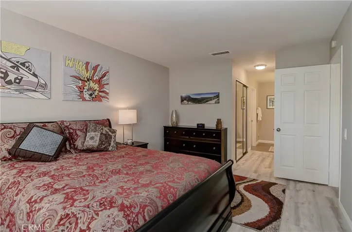 Master suite has two closets...including one walk-in...plus mirrored dressing area.