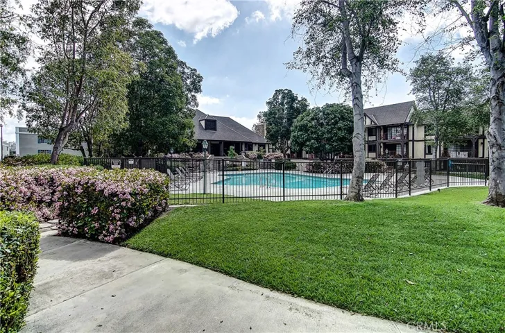 Park-like grounds make a perfect backdrop for inviting pool area.