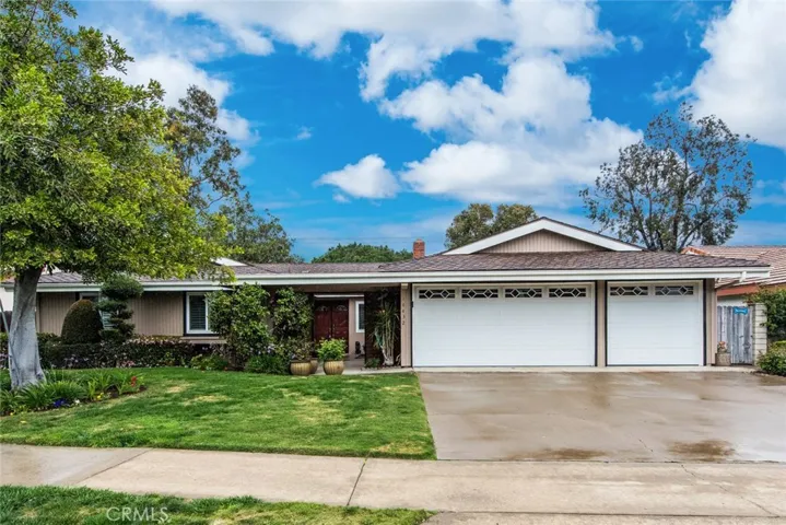 This mid-century ranch style home has great curb appeal and a 3-car garage!