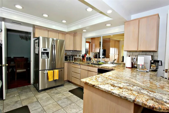 Upgraded kitchen with granite countertop.