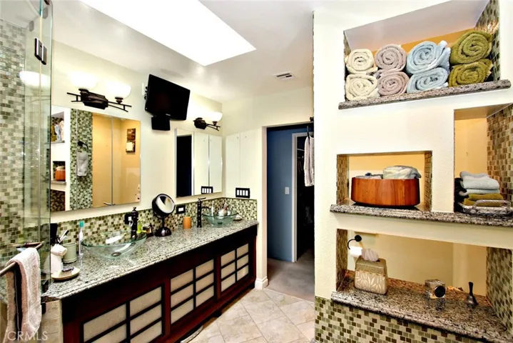 Master bath with separate shower (Hans Grohe shower system) large Whirlpool tub, Toto toilet (Neorest 500) Radiant heat floor, German made medicine cabinets, Italian glass wall.