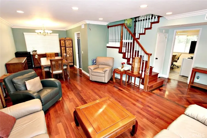 Beautiful hardwood floor and charming stair system.
