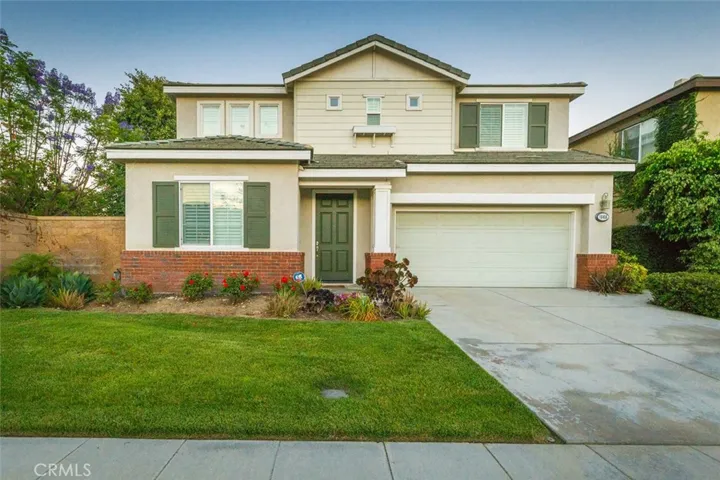 Large two-car garage is equipped with a bike rack, and has additional space for storage.