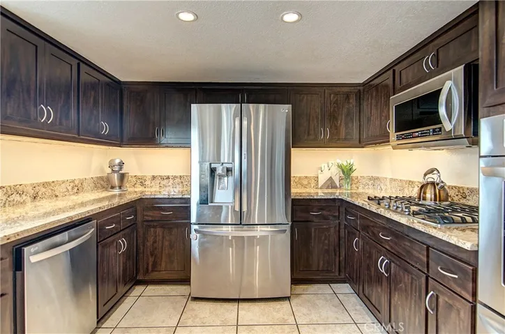 Granite counter tops, wood cabinetry, recessed lighting...this home has it all!