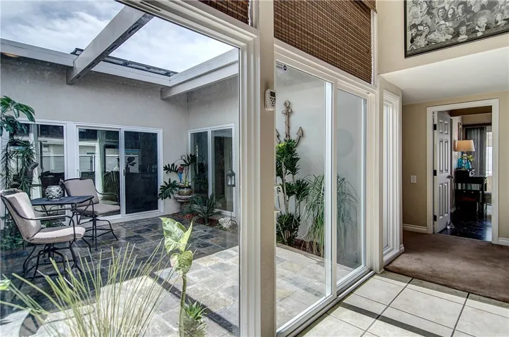 This enclosed outdoor atrium can be accessed through 3 different rooms in the house.