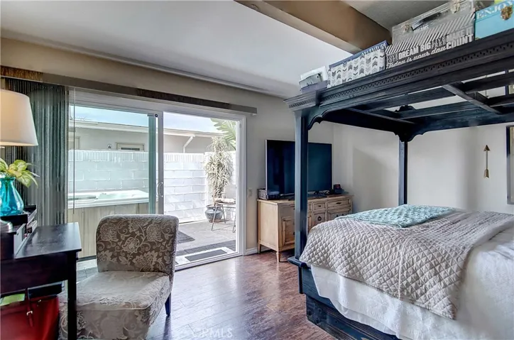 Master bedroom leads directly to the side yard where there is an above ground spa.