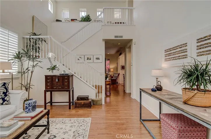 Formal living room boasts high quality Hardwood Like Laminate Floors.